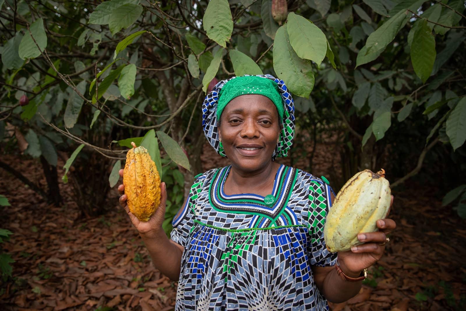 Farmer holding two cocoa pods